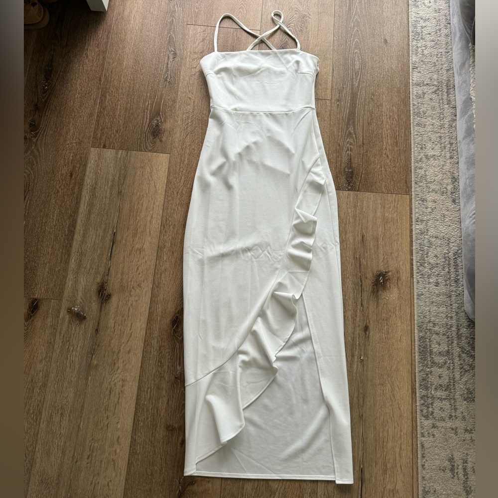 White maxi dress with ruffled slit